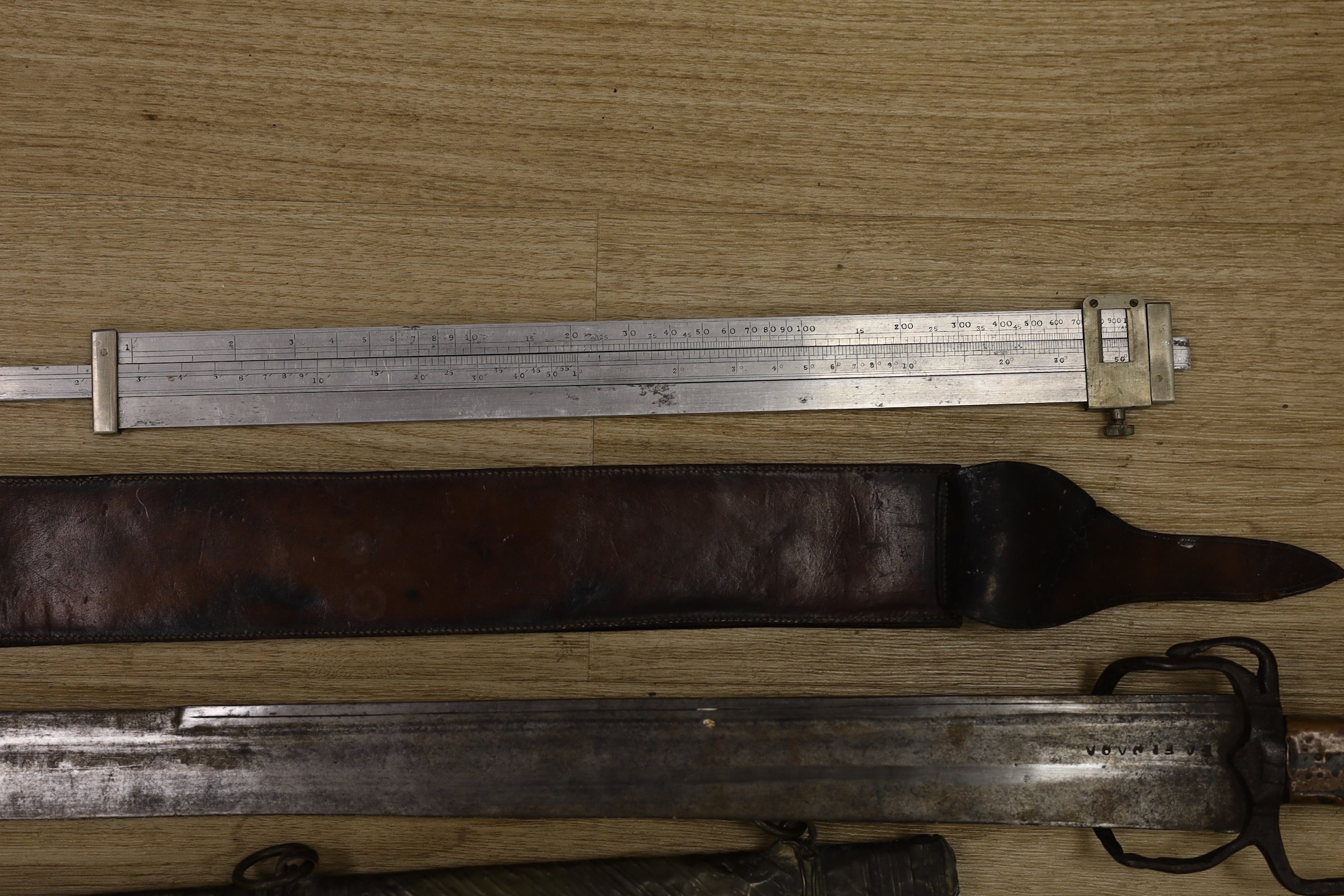 A Moroccan nimcha sword with associated Andrea Ferrara (Scottish) blade and a scabbard together with a court sword and an Aston & Mander Ltd. Mk VI military rule in leather case